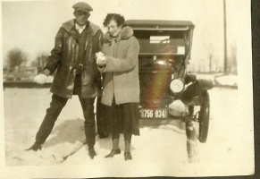14f Gentleman and Lady in front of car